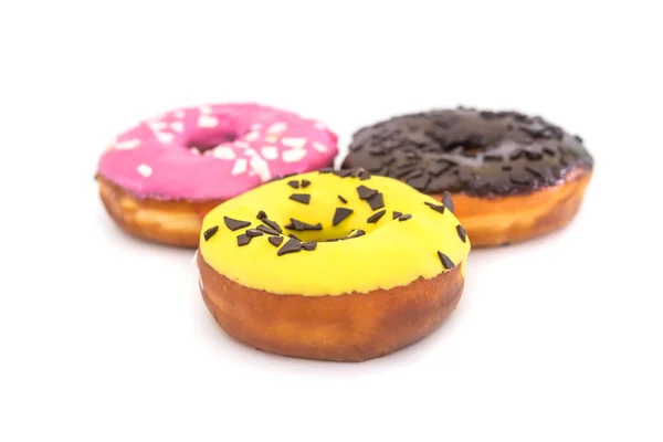 Drei Traditionelle Amerikanische Donuts Mit Schokolade Gelber Rosa Glasur Und — Stockfoto