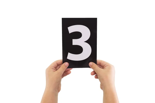Zwei Hände Halten Eine Schwarze Papierkarte Mit Der Nummer Isoliert — Stockfoto