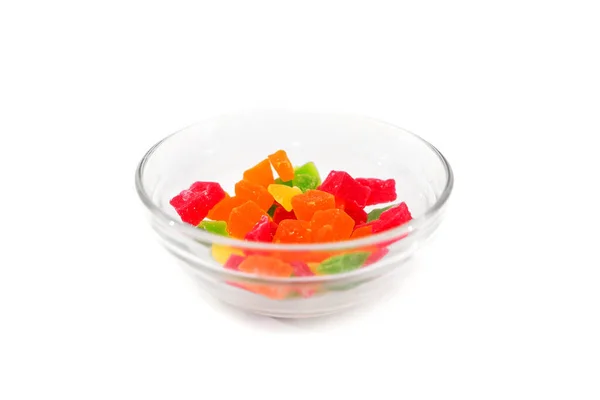 白底玻璃器皿中的糖果水果 — 图库照片