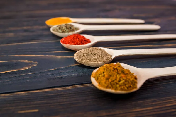 Different Spices Wooden Spoons Wooden Background — Fotografia de Stock