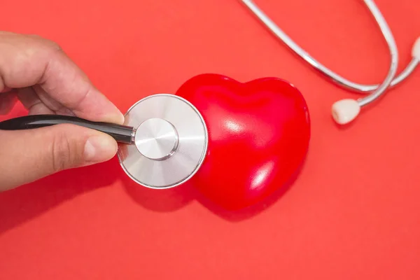 Close Doctor Hand Stethoscope Examine Heart Health Care Concept Red — Stock Photo, Image