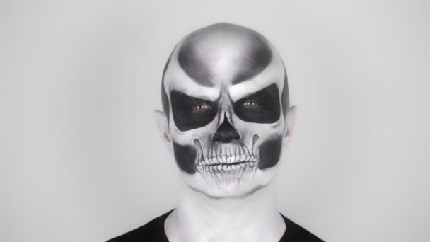 Man Horrible Halloween Skeleton Makeup Looks Camera Grins Shooting Studio — Stock Video