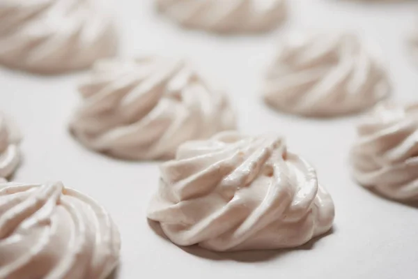 Cooked homemade meringue cookies on baking paper — Stock Photo, Image