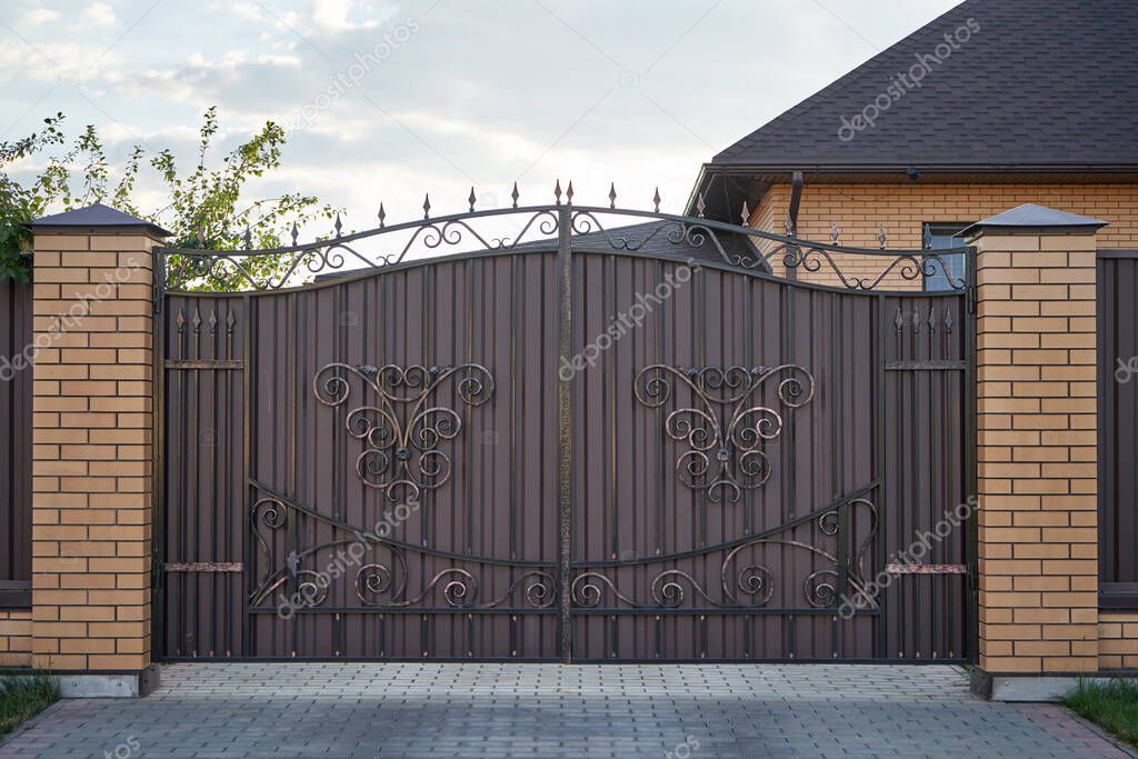 Forged metal gates with ornate lines in a private house