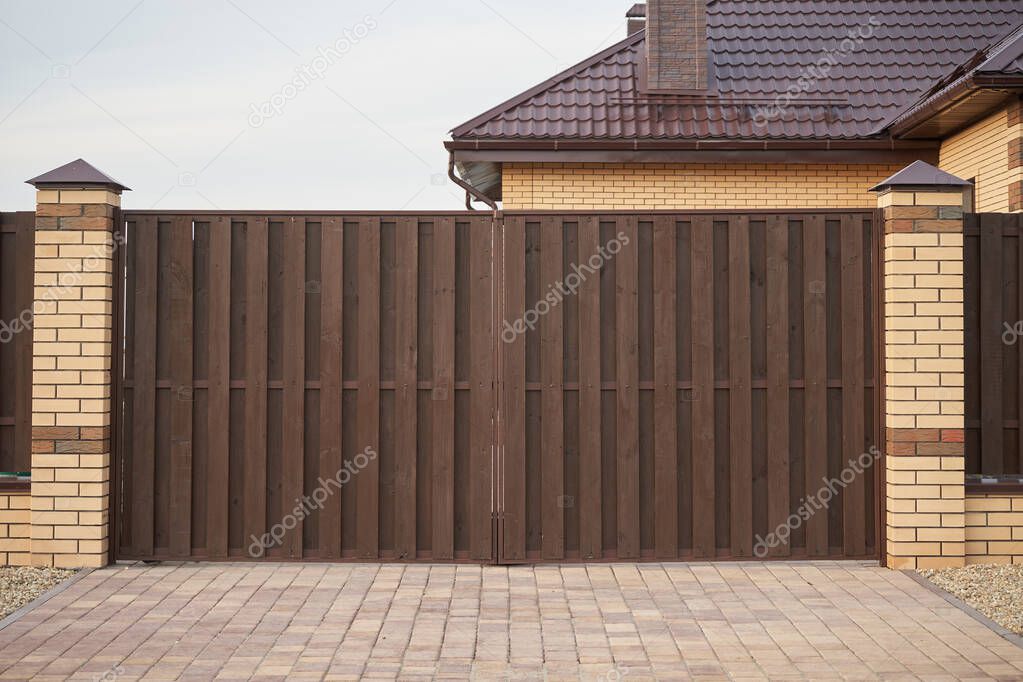 Brown wooden gate and fence