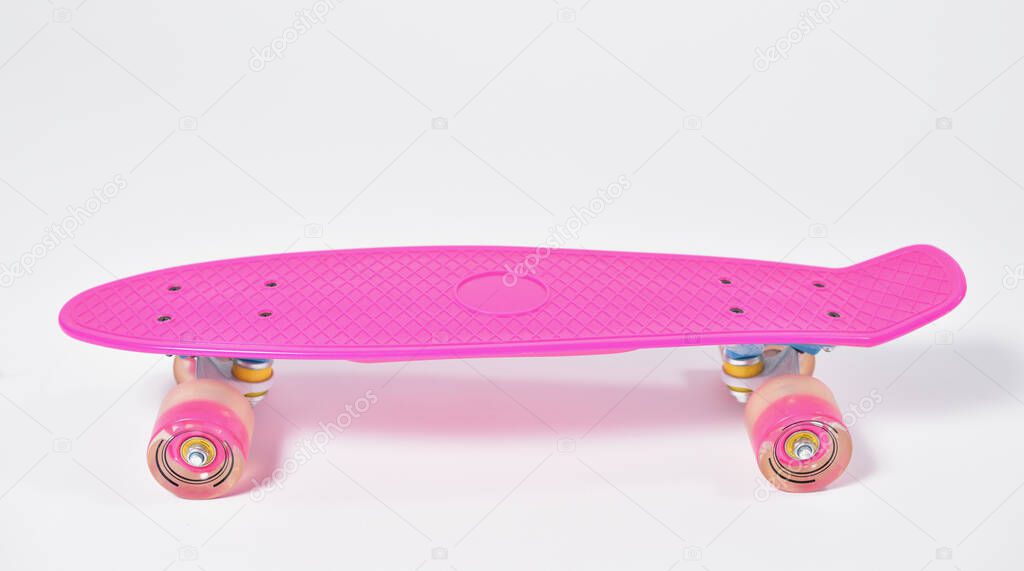 Pink plastic skateboard