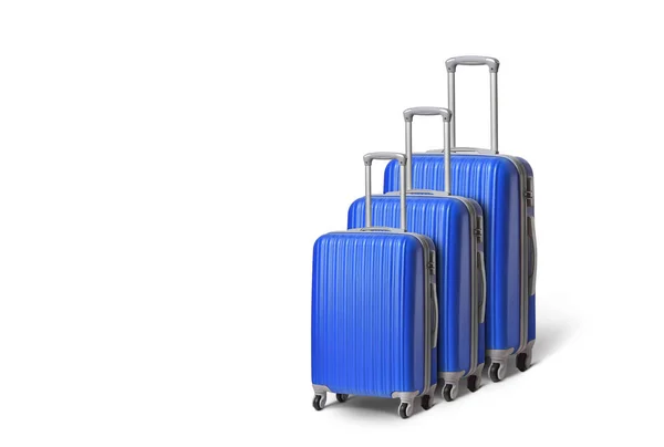 Различные размеры голубого чемодана на белом фоне — стоковое фото