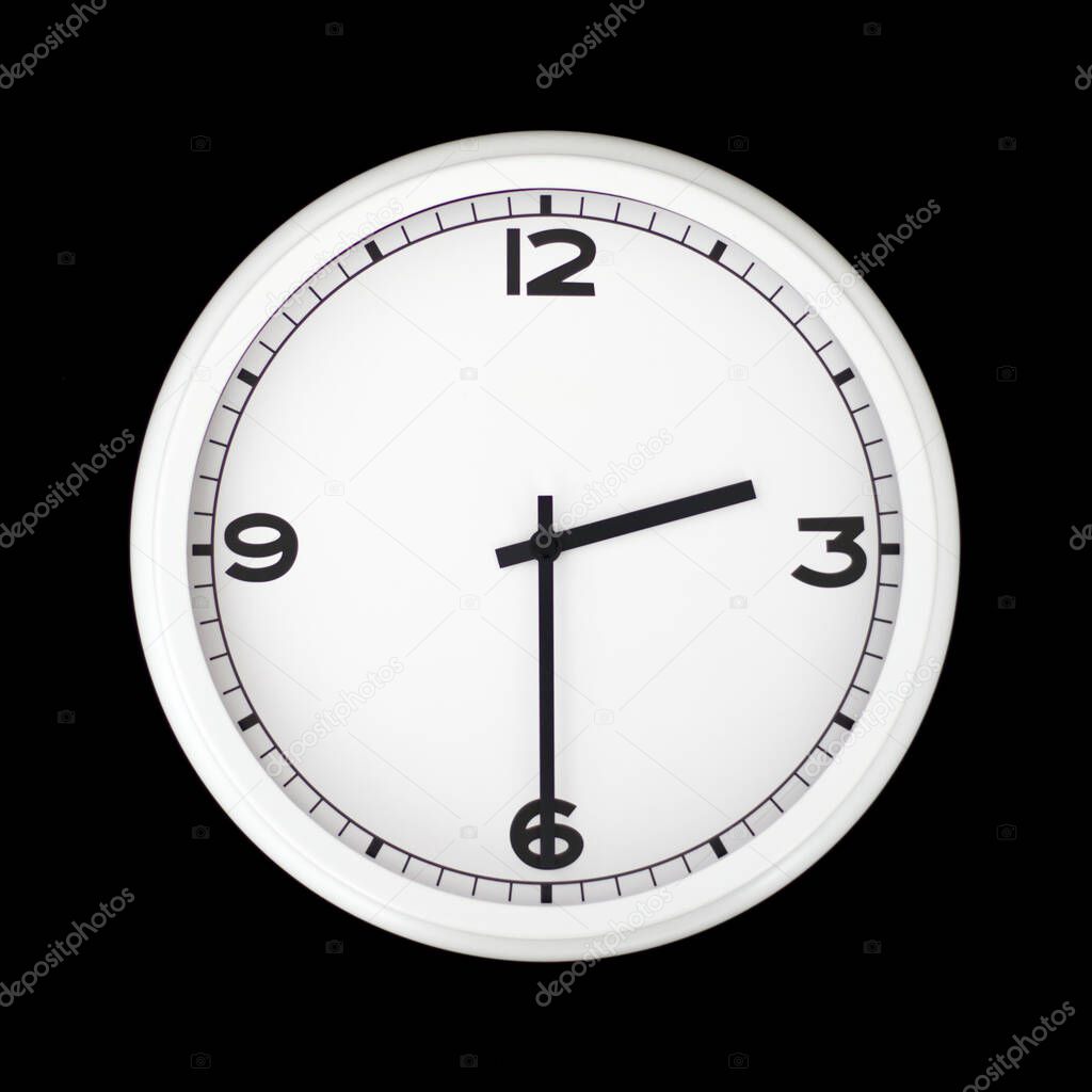 White round analog wall clock isolated on black background, its half past two.