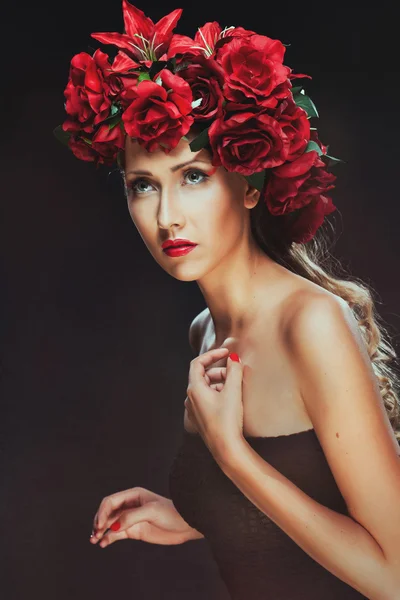 Girl in black and flowers on her head. Beauty women.Jewelry and