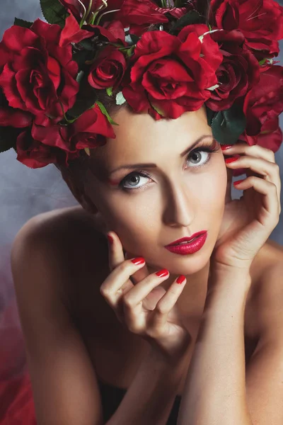 Girl in black and flowers on her head. Beauty women.Jewelry and