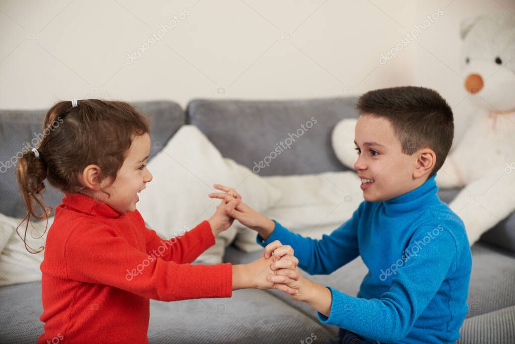 Boy And Girl Holding Hands While Playing Together Childhood Larastock Boy And Girl Holding Hands While Playing Together Childhood Larastock