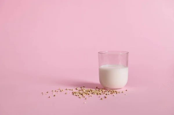 Raw Buckwheat Seeds Glass Milk Pink Background Closeup Concepts International — Stock Photo, Image