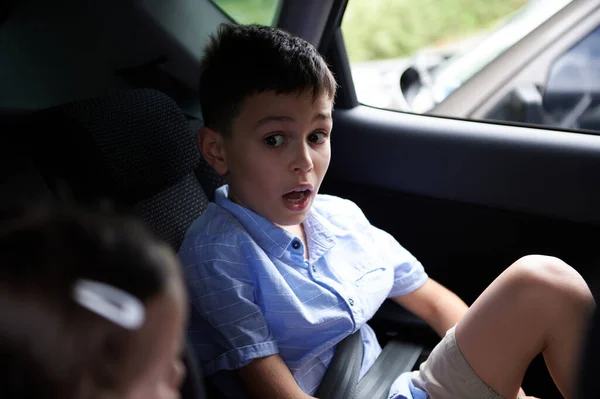 Children wearing a seat belt in the car