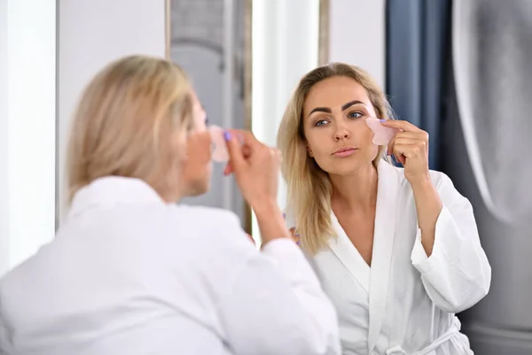 Charming Young Woman Bathrobe Performing Lymphatic Drainage Facial Massage Gua — Stok fotoğraf