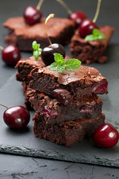 Brownie with cherries and mint — Stock Photo, Image