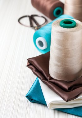 spools of thread with fabric