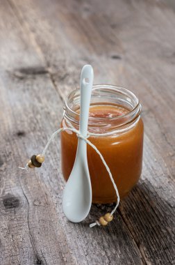 Caramel sauce in glass jar