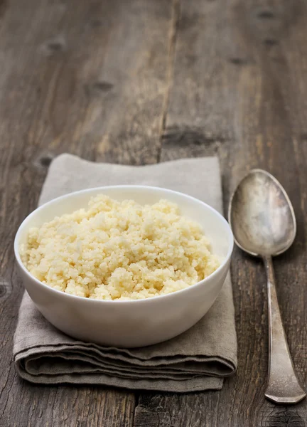 Cooked couscous in a white bowl — Stock Photo, Image