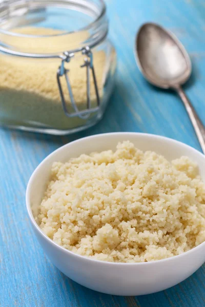 Cooked couscous in a white bowl — Stock Photo, Image