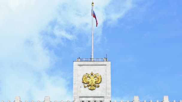 The flag of Russia and The coat of arms of the Russian Federation on the top of The House of the Government of the Russian Federation (the White House). UHD - 4K. September 02, 2016. Moscow. Russia — Stock Video