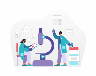 Erkek ve kadın araştırmacılar laboratuarda çalışıyor.
