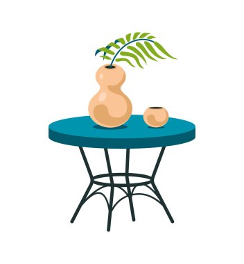 Masada tropikal yapraklı dekoratif vazo. Minimalist heykel kasesi ve fincanı olan klasik mavi İskandinav masası.