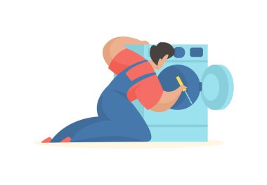 Adam çamaşır makinesini tamir ediyor. Hizmet profesyonel bakım