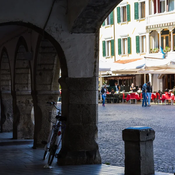 Bicicle resting in the village square — Stock Photo, Image