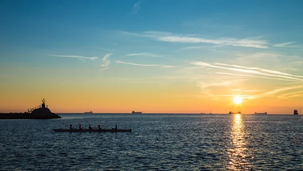 Canoeing in the evening in bay of Trieste — Stock Photo, Image
