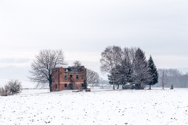 snow covering an abandoned farm