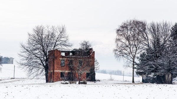 snow covering an abandoned farm