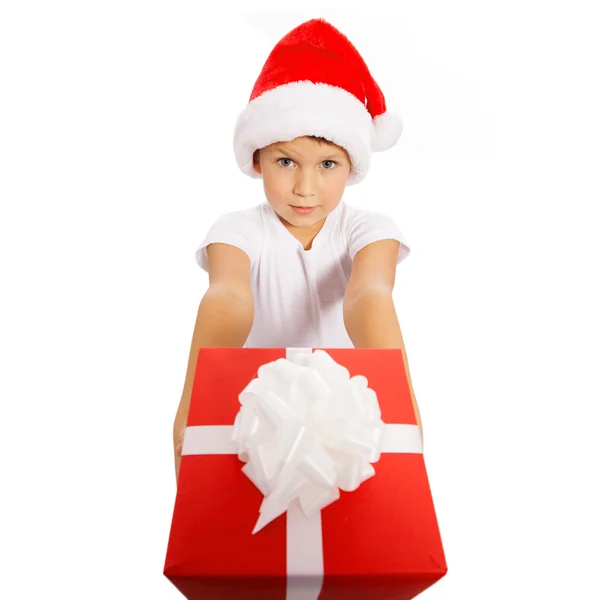 Child holding Christmas gift box in hand. Isolated on background — Stock Photo, Image