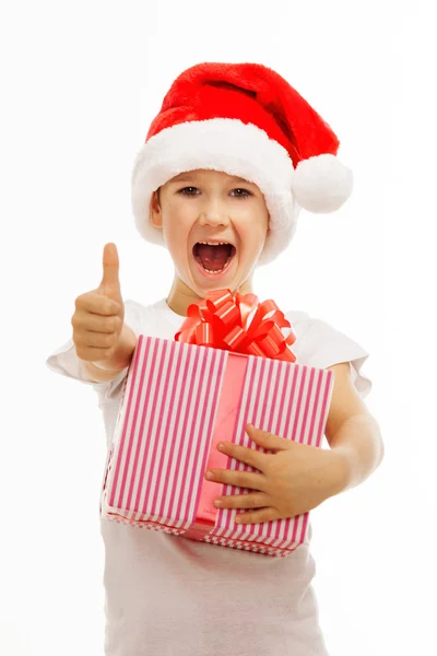 Child holding Christmas gift box in hand. Isolated on background — Stock Photo, Image