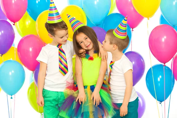 Group of joyful little kids having fun at birthday party — Stock Photo, Image