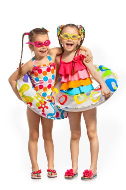 Happy kids in swimsuit and inflatable rings clipart
