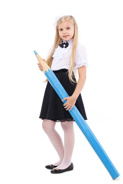 Hezká blondýnka školačka s velkou modrou tužkou — Stock fotografie