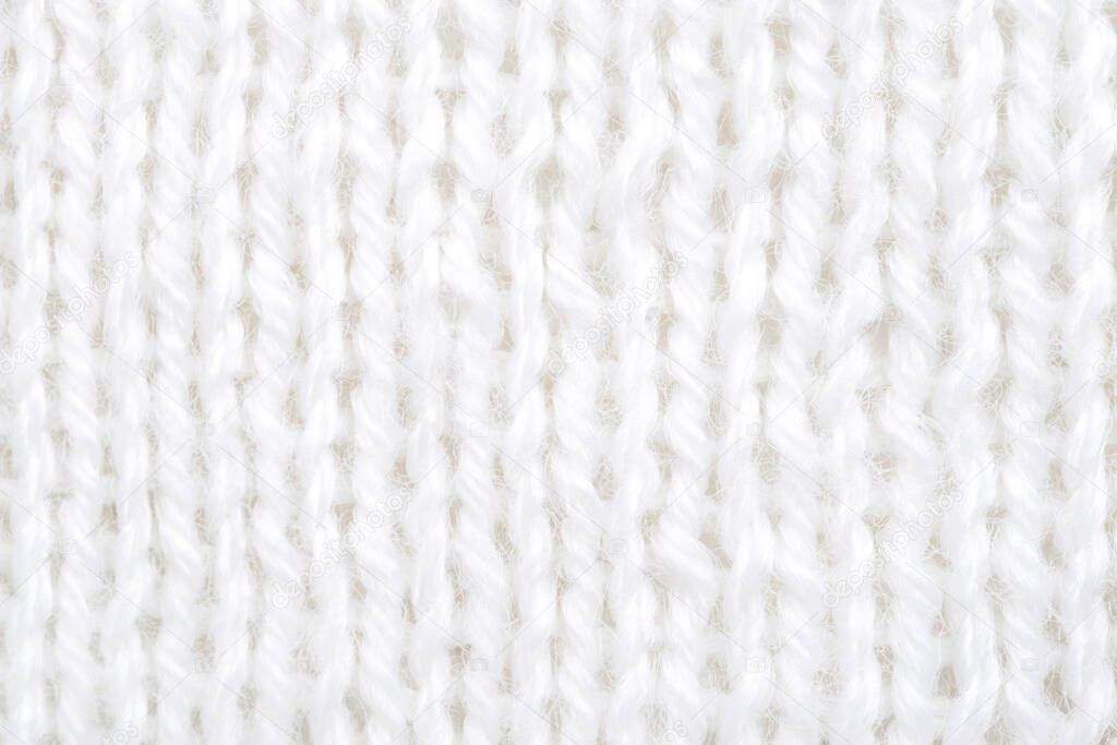  Close-up of hand made white cotton knit texture.