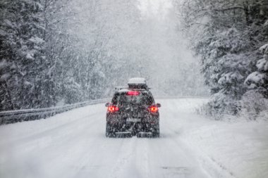 Car in snowstorm clipart