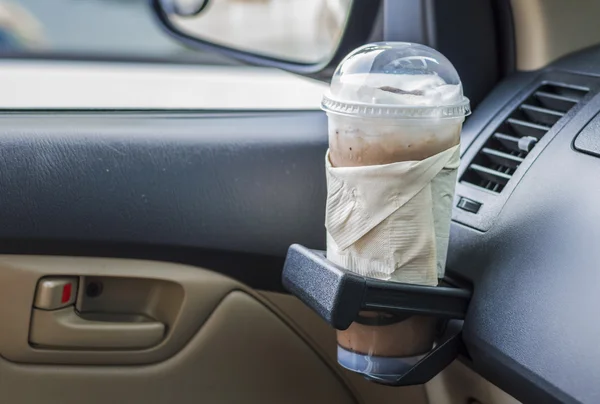 Bottle with coffe in a car interior — Stock Photo, Image