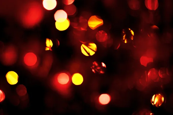 Gold und rote Lichter glitzern Hintergrund defokussiert — Stockfoto