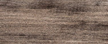 Kırsal ahşap arka plan. Eski ahşap tahtaların dokusu. Arka planda çizikler olan koyu kahverengi ahşap bir doku..