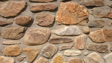 Arka plan için kumtaşı sarı duvar dokusu. Taş mermer arka plan