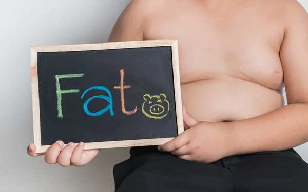 Obese fat boy holding blackboard — Stock Photo, Image