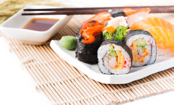 Sushi on white dish isolated Royalty Free Stock Photos
