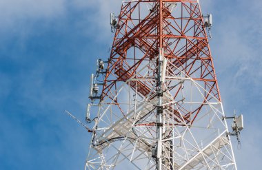 communication antenna tower with blue sky clipart