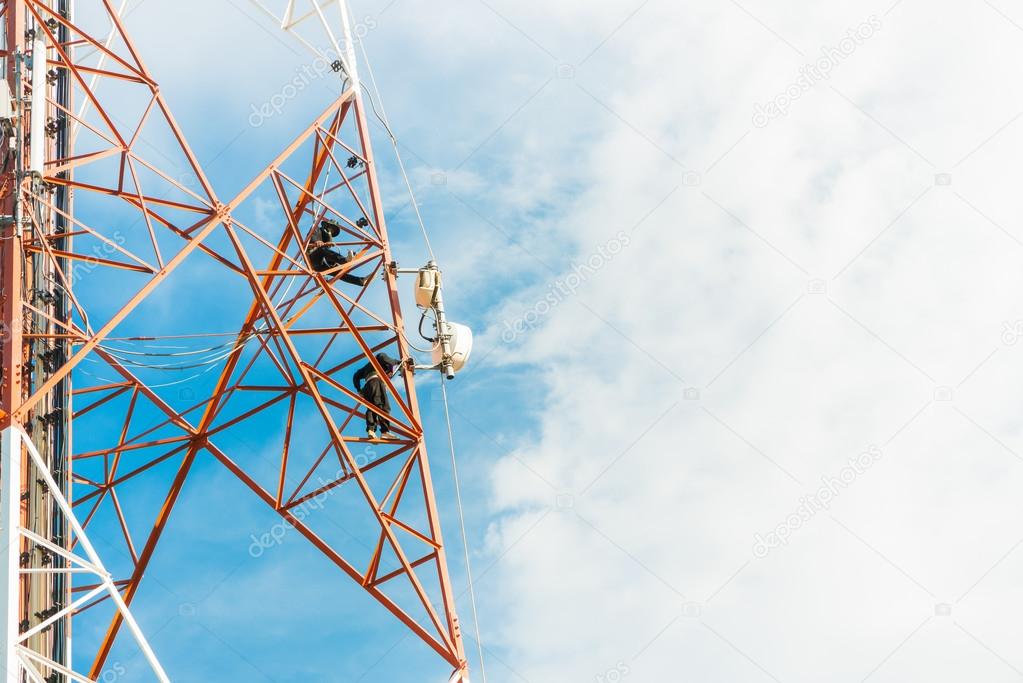 worker work on mobile tower