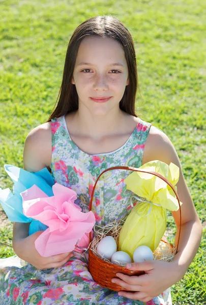 Smiling cute teen girl with Easter chocolate in colorful paper e — Stock Photo, Image
