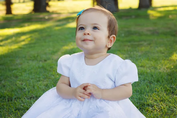 Cute happy little smiling baby girl in white dress — Stock Photo, Image
