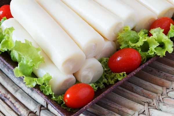 Closeup of Heart of palm (palmito) with cherry tomato — Stock Photo, Image