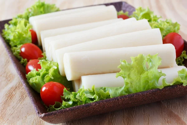 Closeup of Heart of palm (palmito) with cherry tomato — Stock Photo, Image